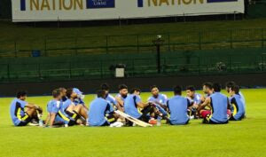 Team India players sitting in a hurdle